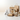 Collection of paper products including bags, cups, and containers on a white background